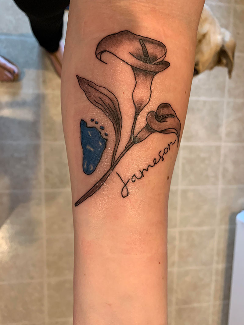 One line Calla lily flower tattoo located on the side