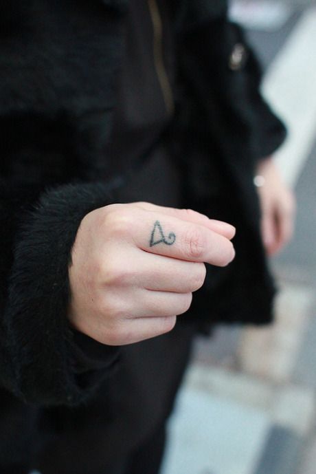 The Meaning Behind the Coat Hanger Tattoo: A Symbol of Strength and Resilience - Impeccable Nest