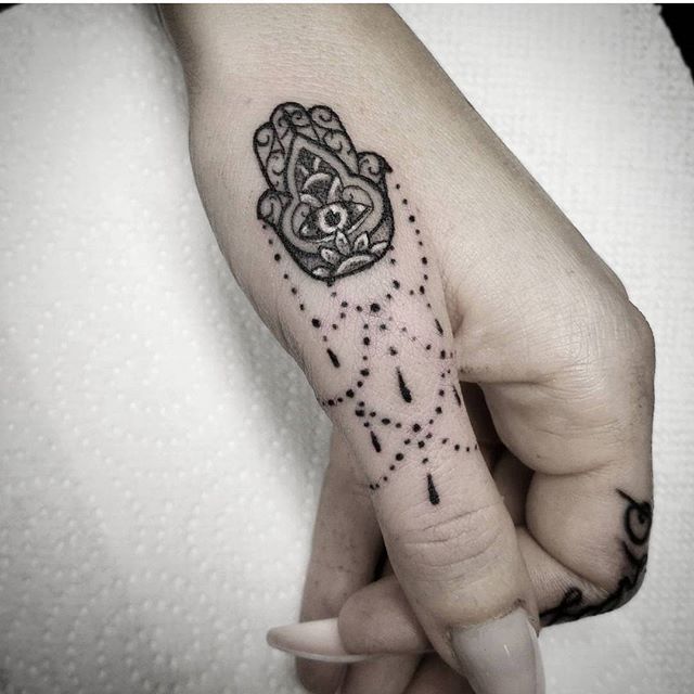 Discover the Meaning of Hamsa Tattoos: A Look Into the Meaning Behind These Symbolic Ink Designs - Impeccable Nest