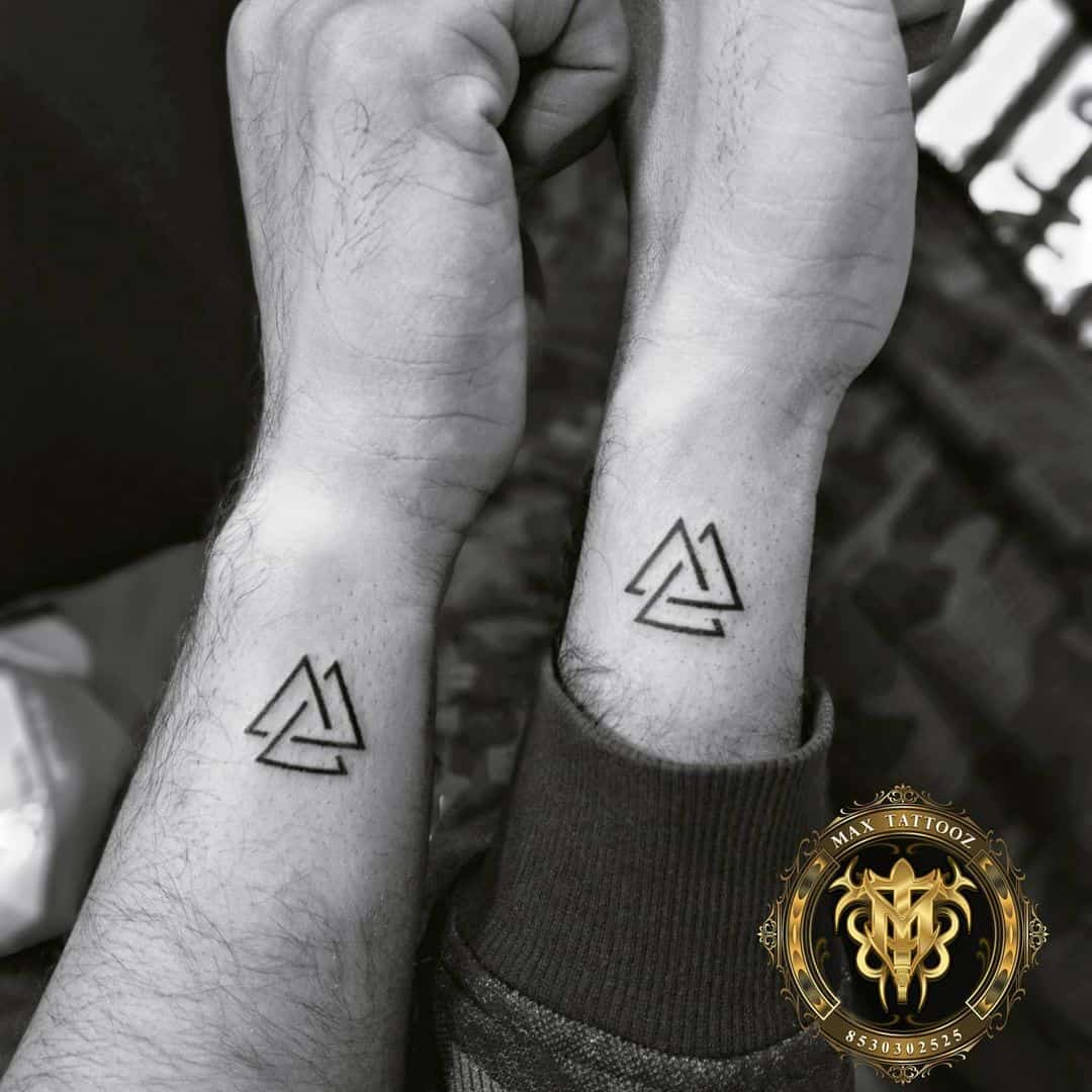 Minimalist triangle tattoo design