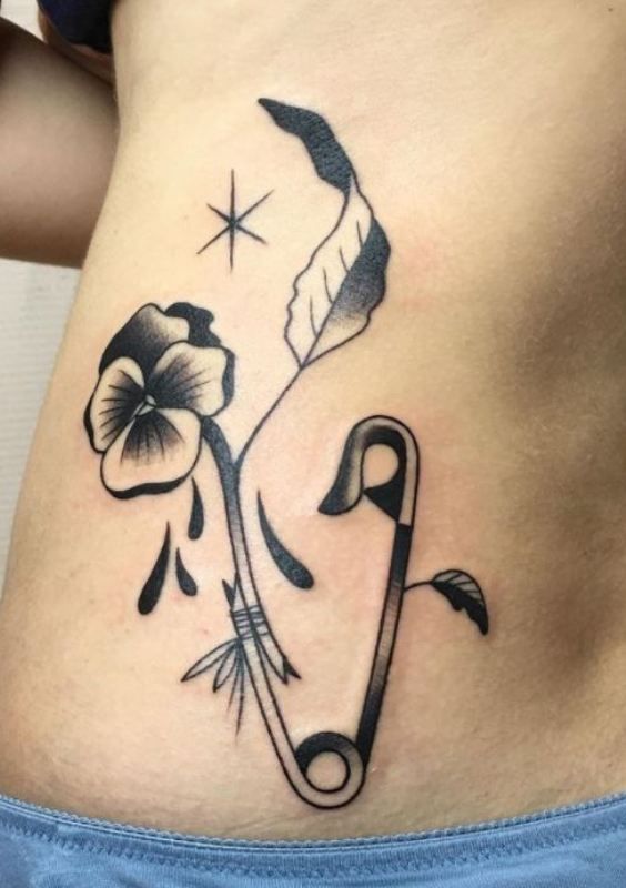 Exploring the Meaning of a Safety Pin Tattoo: A Guide to the Meaning Behind This Tattoo Design