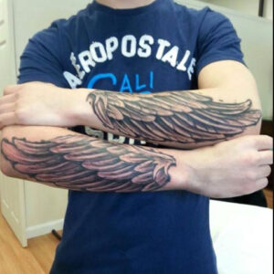 Unveiling the Mystery: What Do the Forearm Wing Tattoos Mean?