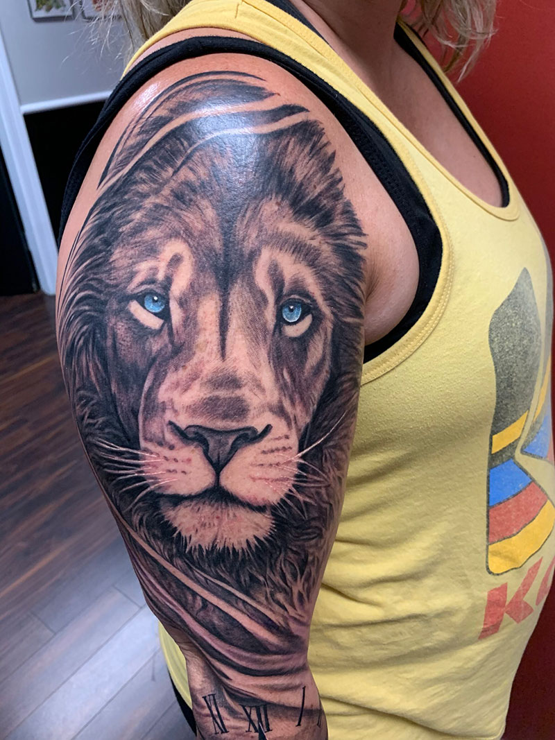Unveiling the Symbolic Power: Lion with Blue Eyes Tattoo Meaning Explored