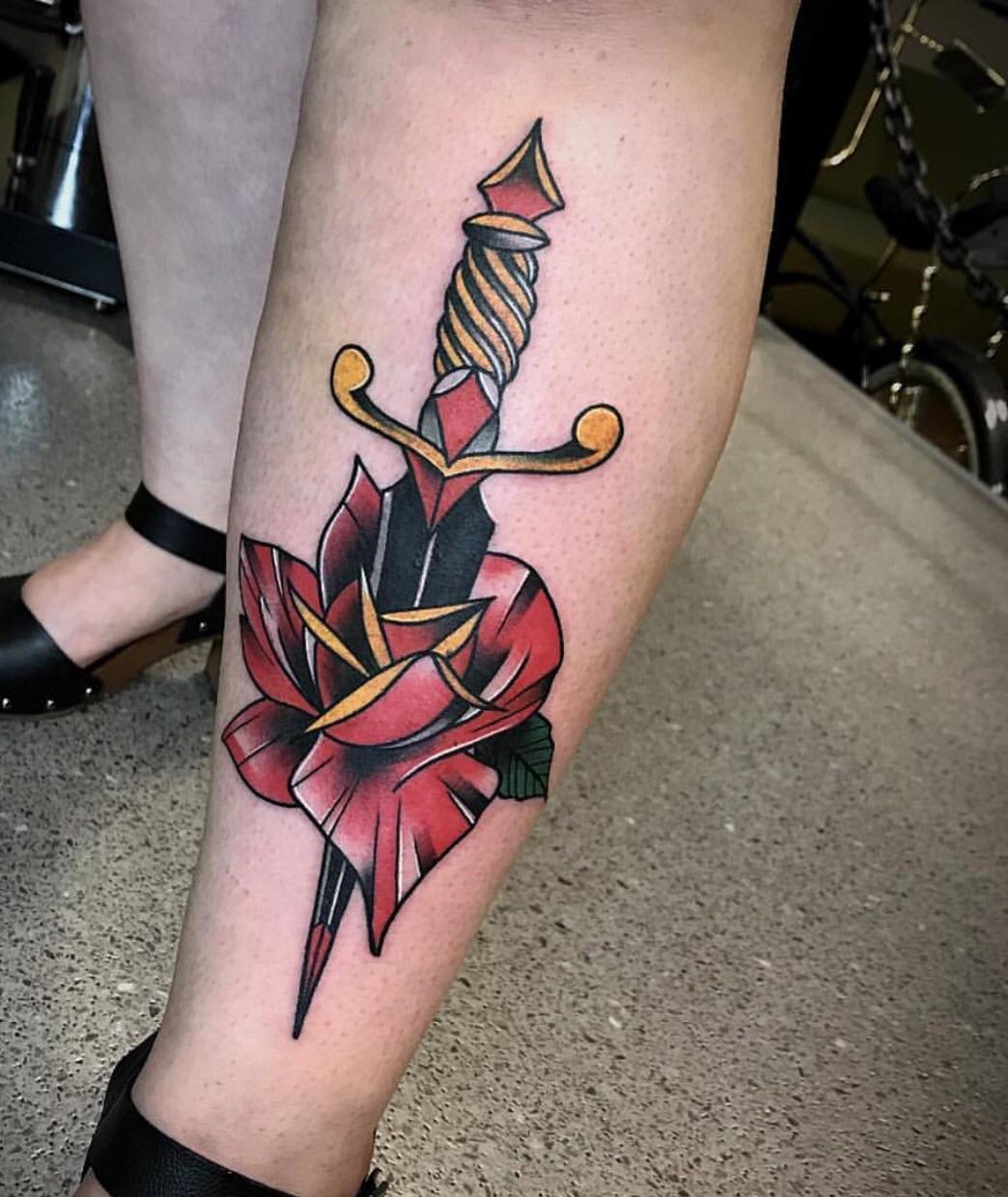 Unveiling the Secrets: Rose and Dagger Tattoo Meaning Explored