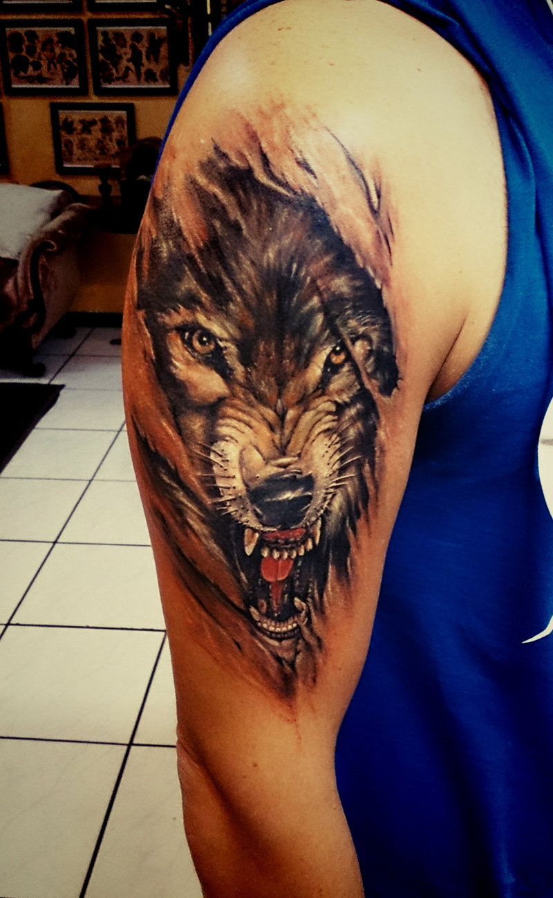 Unveiling the Symbolic Power: Wolf Tattoos for Guys Meaning Explored - Impeccable Nest