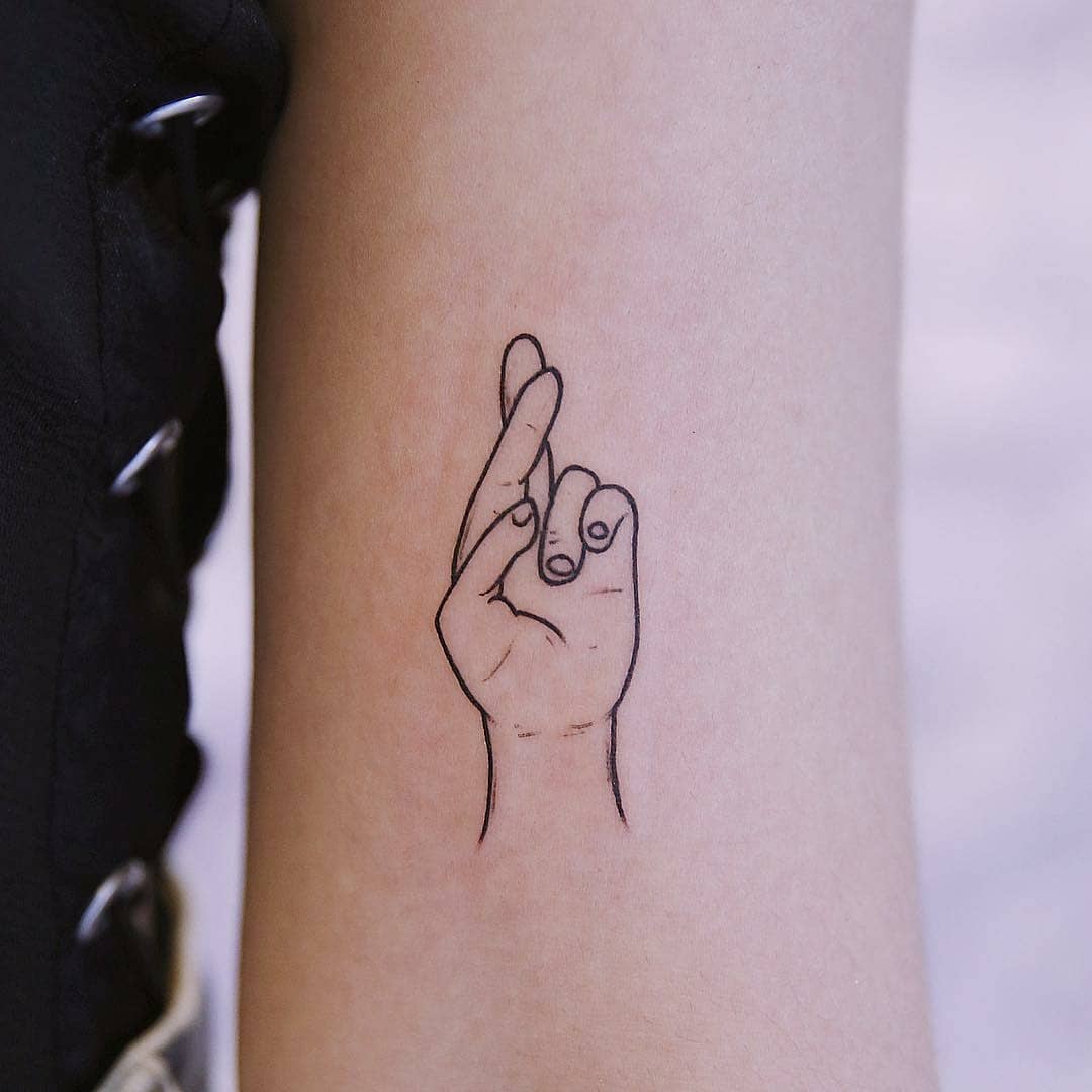 Fingers Crossed Tattoo Meaning: Exploring Tattoo Meanings and Their Cultural Significance