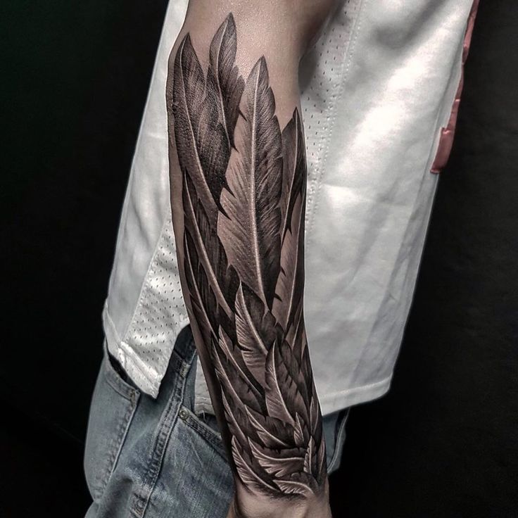 Men's Feather Tattoo Meaning: Exploring the Symbolism and Ideas Behind Feather Tattoos