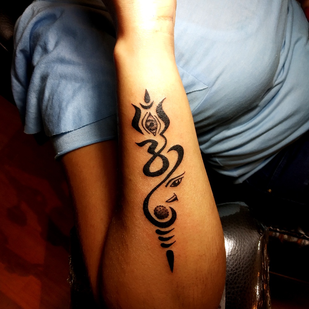 ganesh om symbol tattoo
