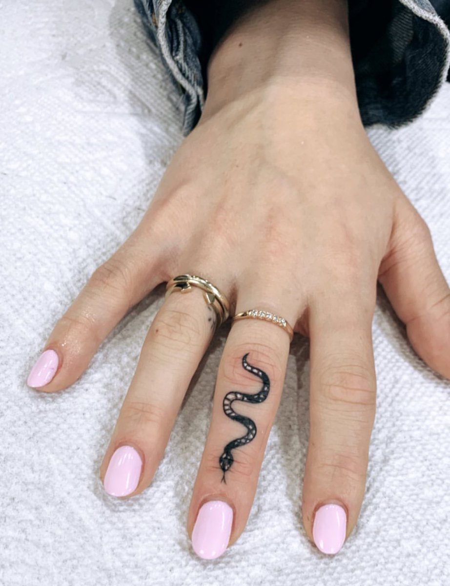 Snake Tattoo on Finger Meaning: Personal Stories and Symbolism Behind Body Art