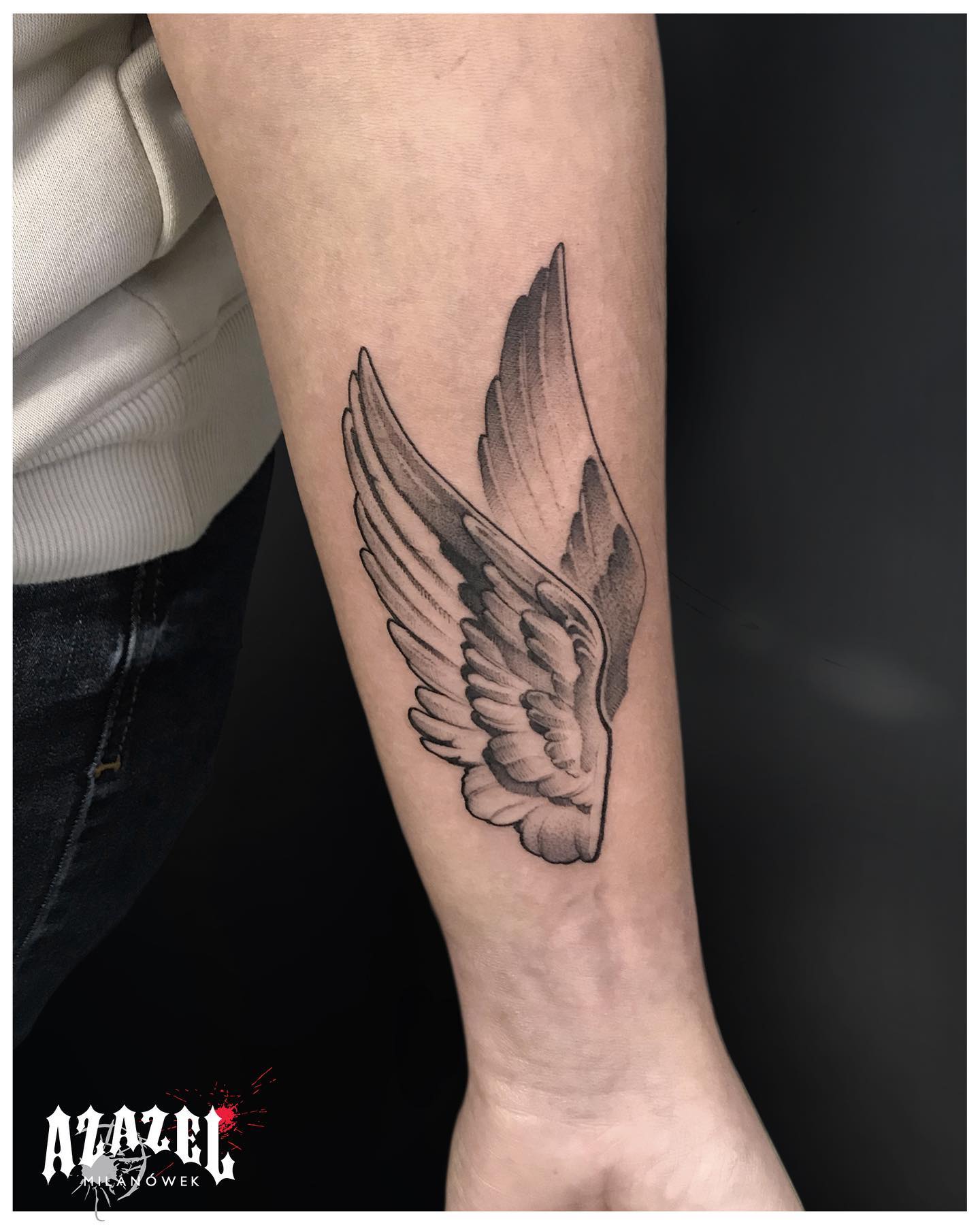 angel wings tattoo on arm