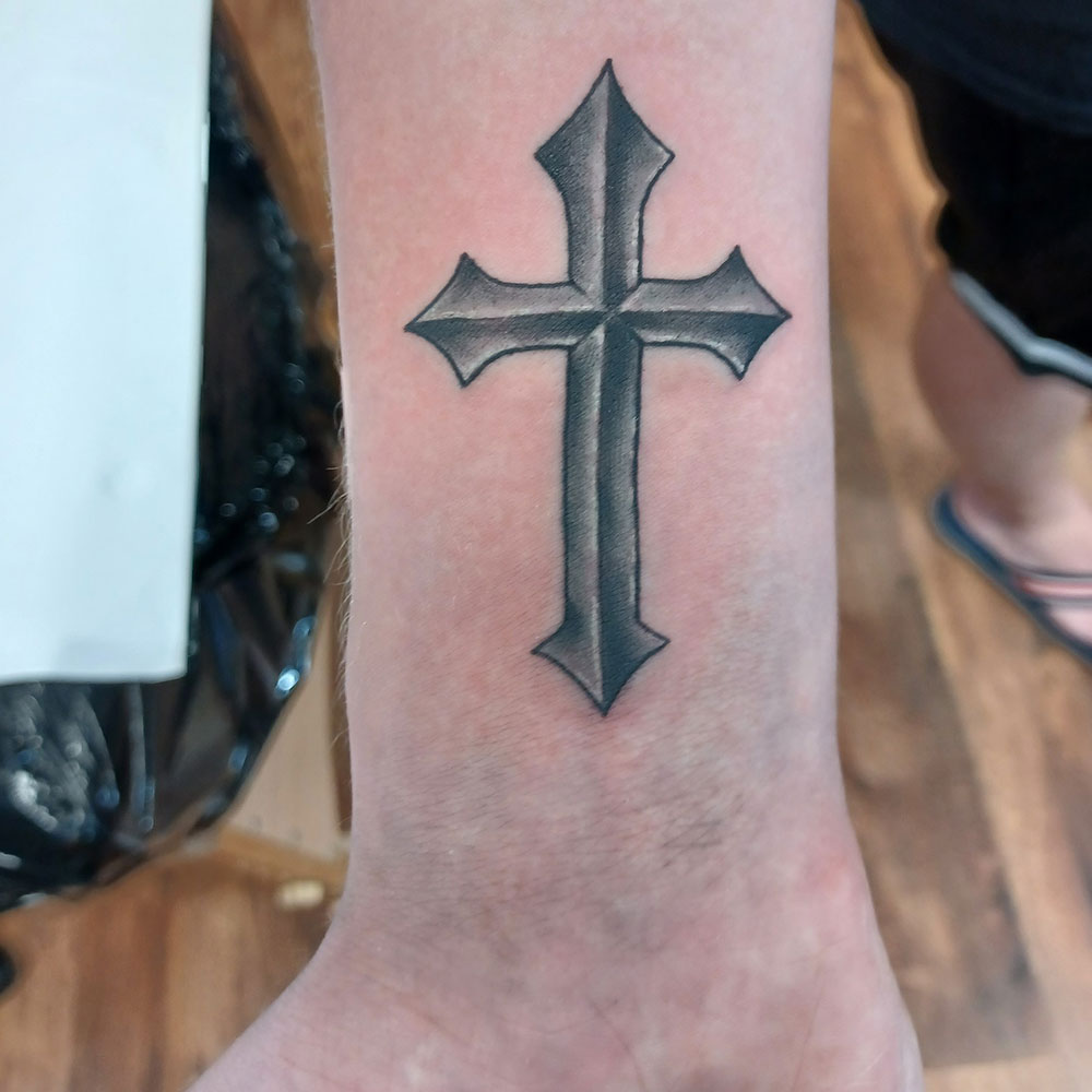 Cross Hand Tattoo Meaning: Explore the Fascinating World of Body Art Symbolism.