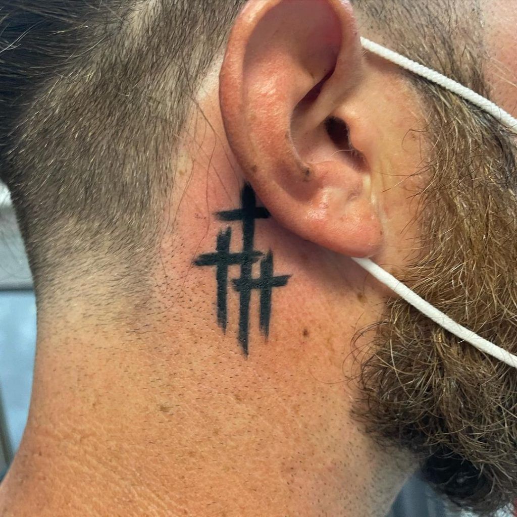 Cross Tattoo Behind Ear Meaning: Uncover the Hidden Meanings Behind Inked Masterpieces