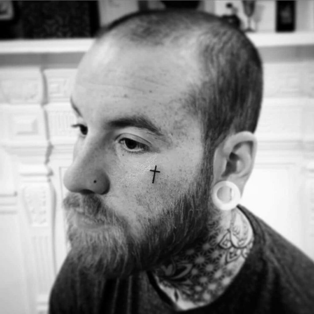 Cross Tattoo Under Eye Meaning: Understanding the Rich Symbolism Behind Tattoos
