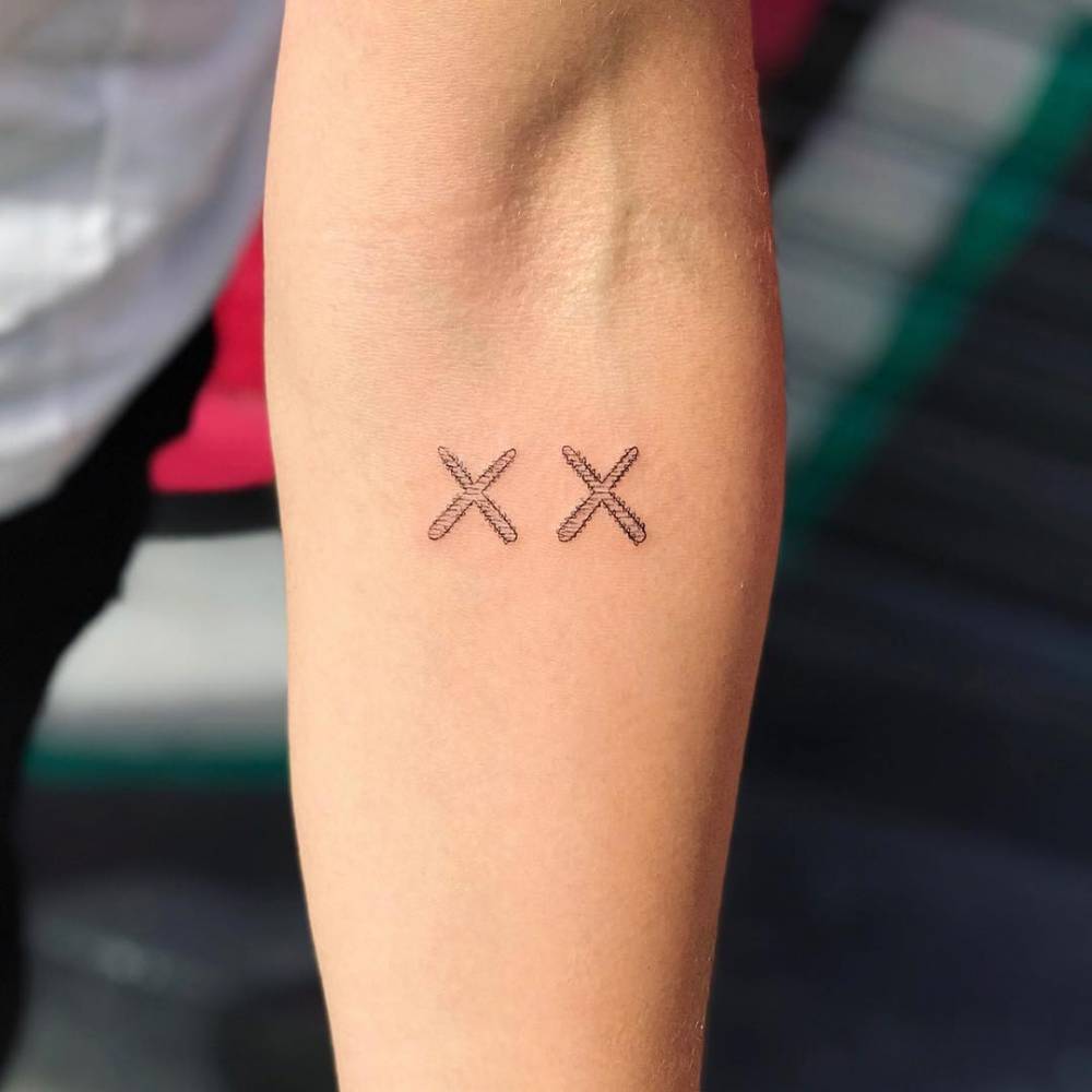 Double X Tattoo Meaning: Comprehending the Significance and Patterns of the Double X Tattoo in the English Language.