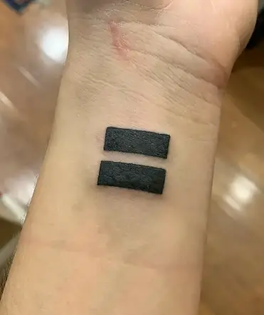 Equal Sign Tattoo Meaning: The significance behind tattoo designs featuring the equal sign explained in the English language.