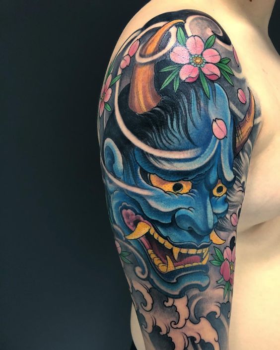 Japanese Mask Tattoo Meaning: The significance and artistic concept behind Japanese mask tattoos.